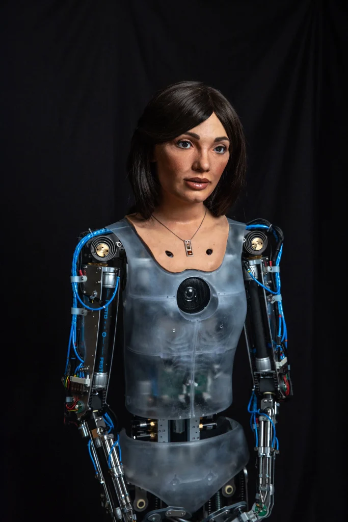 realistic humanoid robot with detailed facial features and visible mechanical components against a dark background
